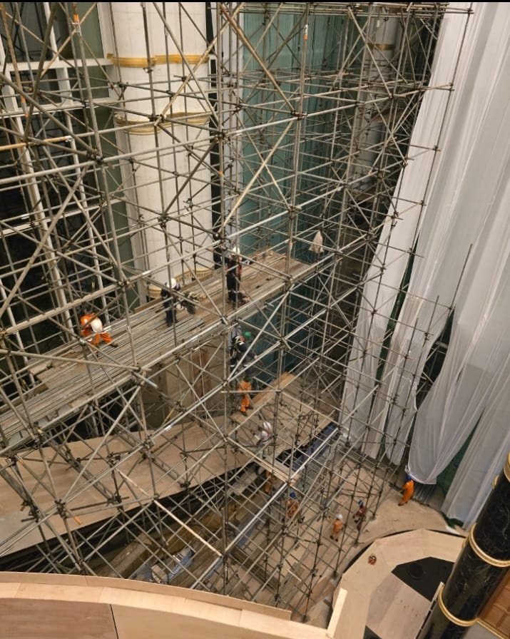 Scaffold installation inside a grand marble atrium